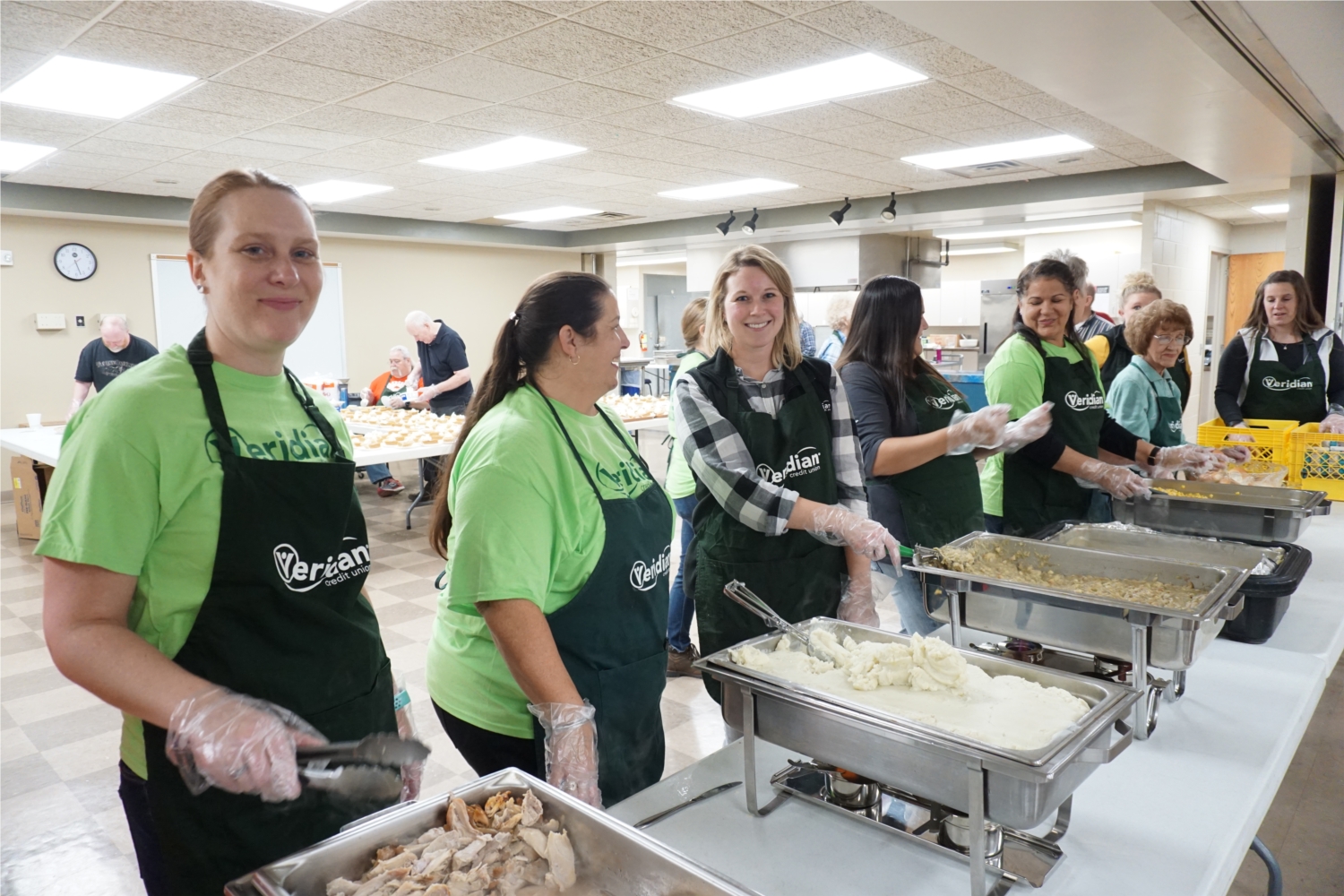 Veridian Credit Union has helped to coordinate a free, community Thanksgiving Dinner in
Waterloo, Iowa each year since 1982. In recent years, the event has drawn 900-1,000
attendees for a warm meal and companionship.