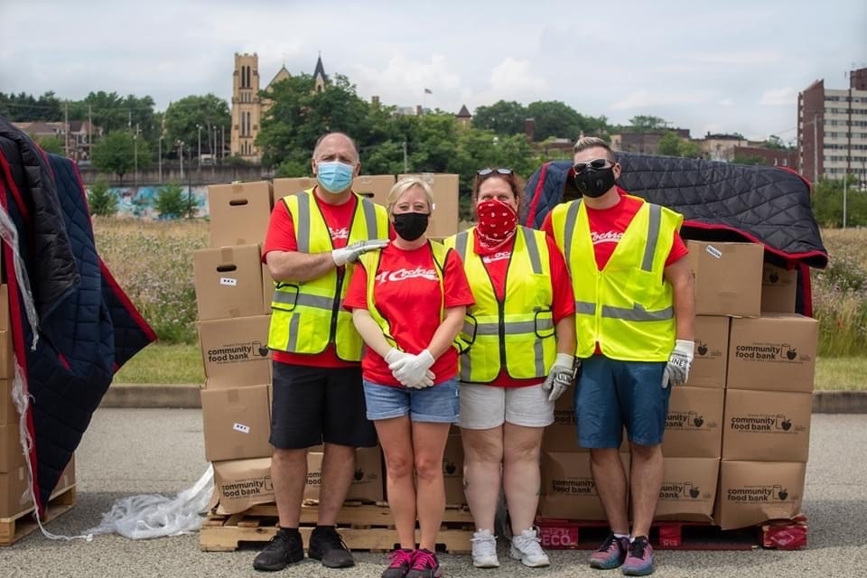 Team Members at the Food Bank, helping pass out food from the Rob Cochran Foundation. 