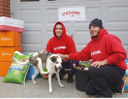 Team Members dropping off food to the local Animal Shelter for Share the Love Event.