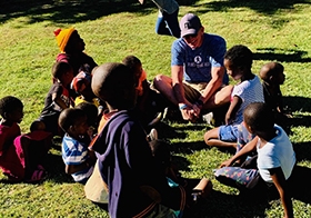 CEO Steve Cummings volunteering his time with the charitable group Arm in Arm in Africa (AIAIA). 