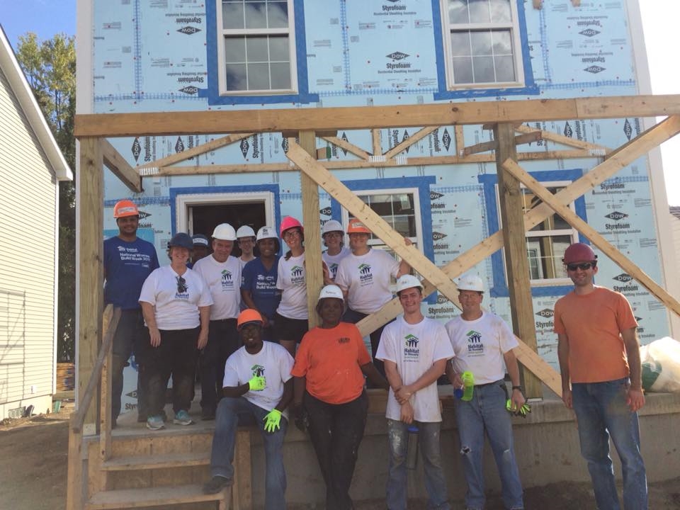 KOST team members volunteering with Habitat for Humanity.