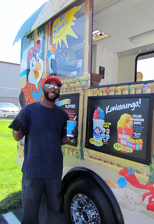 KOST team member enjoying a treat from Kona Ice.