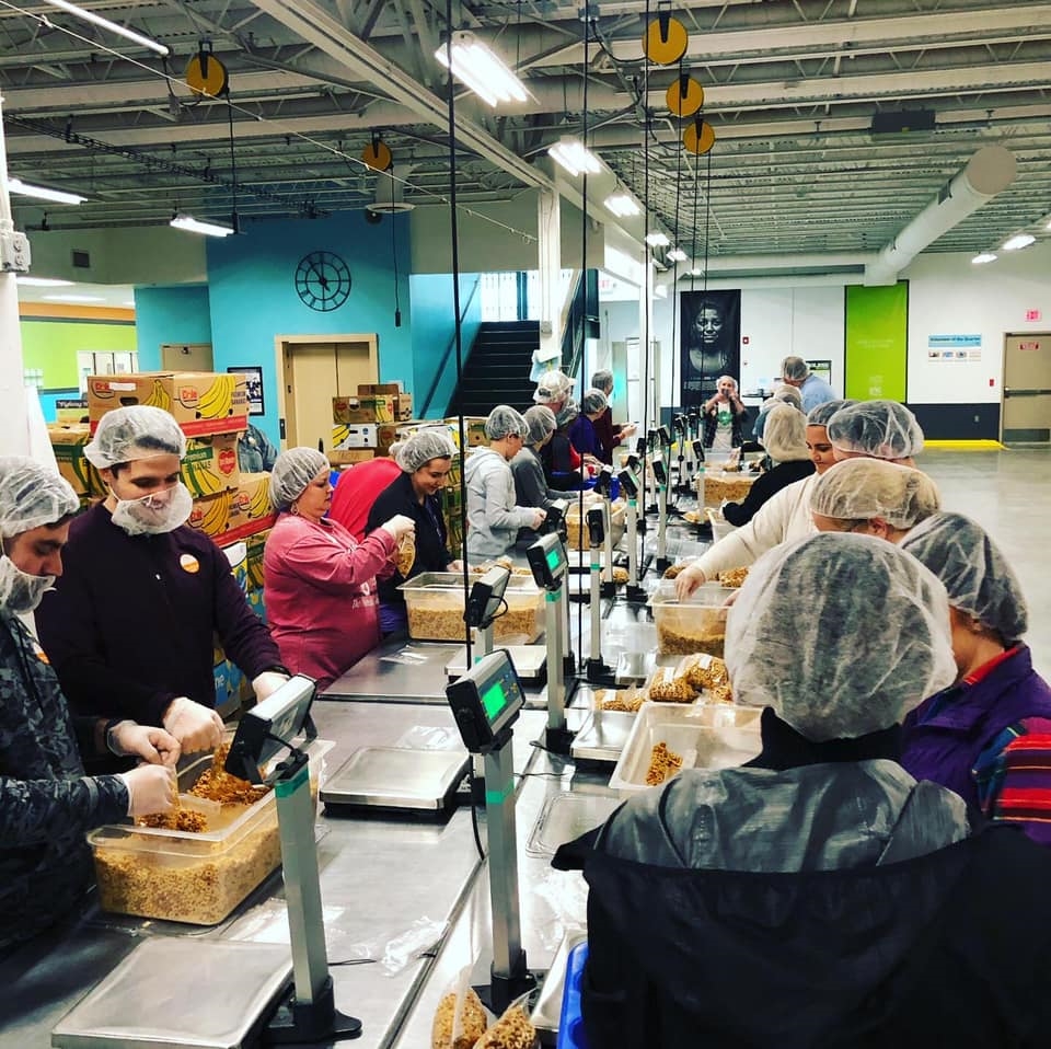 The Oklahoma City office packing food during their yearly volunteer trip to the Regional Foodbank.