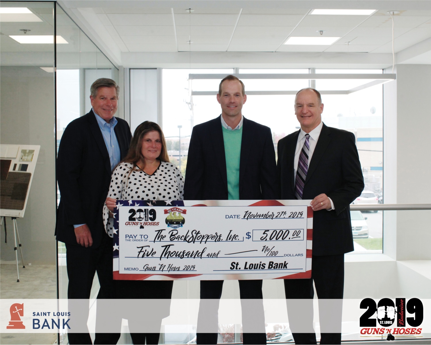 Saint Louis Bank donates $5,000 to The BackStoppers Inc. 2019 Guns 'N Hoses event.  Saint Louis Bank champions this community. Being involved in an organization that profoundly supports the first responders and their families, perfectly aligns with our core values. We are inspired by these heroes (both men and women) and the sacrifices they make daily.  Investing in our community drives Saint Louis Bank, which unites our team members and our family and friends.