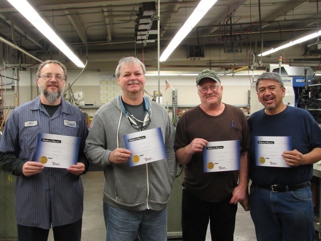 Recognizing four Enoch employees for their years of service to the company. Together, they have over 100 years of machining experience at Enoch!