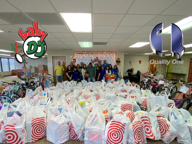 Employees at Quality One value giving back to the community in a variety of ways.  Here, we partnered with “Johnny Magic,” the host of the top-rated morning radio show in Central Florida, and his Baby DJ Christmas Fund & Toy Warehouse program to allow area children from economically disadvantaged families to retain the magic of Christmas.