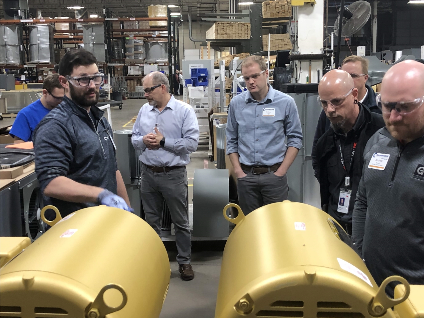 Thomas Little, from the Post-Paint line, hosts a station for visitors on the Cambridge Lean Tour. On this tour, leaders from St. Louis and across the US and world can experience what a lean culture means and the power of autonomous workers.