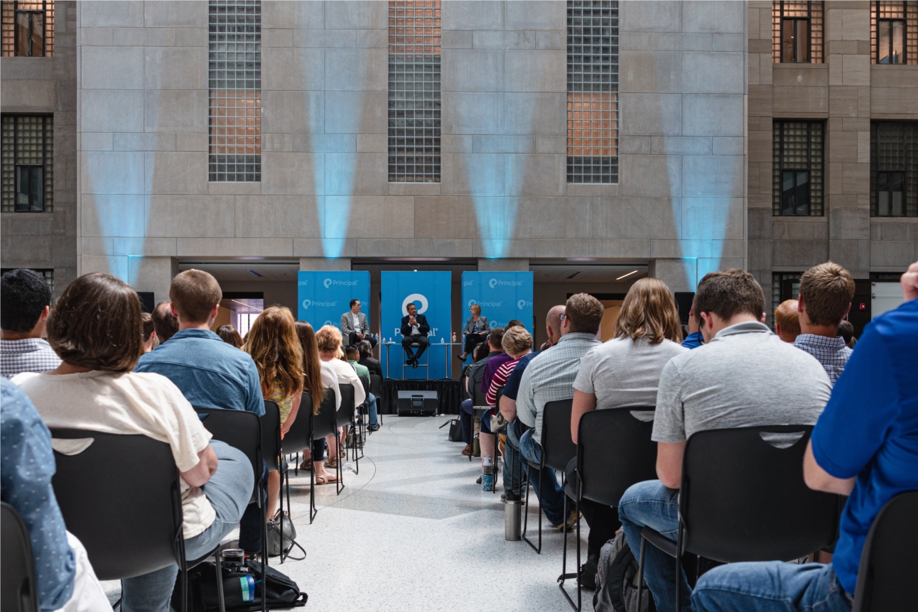 Employees participate in a 2019 town meeting at the global headquarters of Principal in Des Moines. Speakers included Senior Vice President and CHRO Jon Couture, Chairman, President & CEO Dan Houston, and Executive Vice President and CFO Deanna Strable.