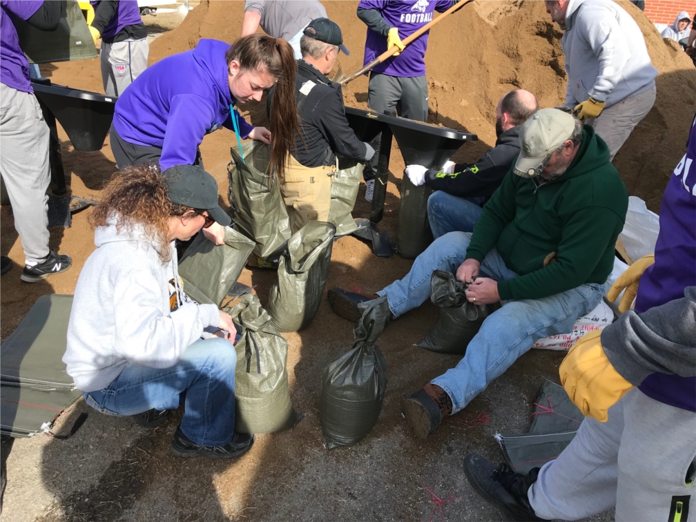 Sandbagging in Iowa Falls when the river had potential of an ice jam and flooding.  Green Belt Bank & Trust staff put on their "outdoor work clothes" and help the community!