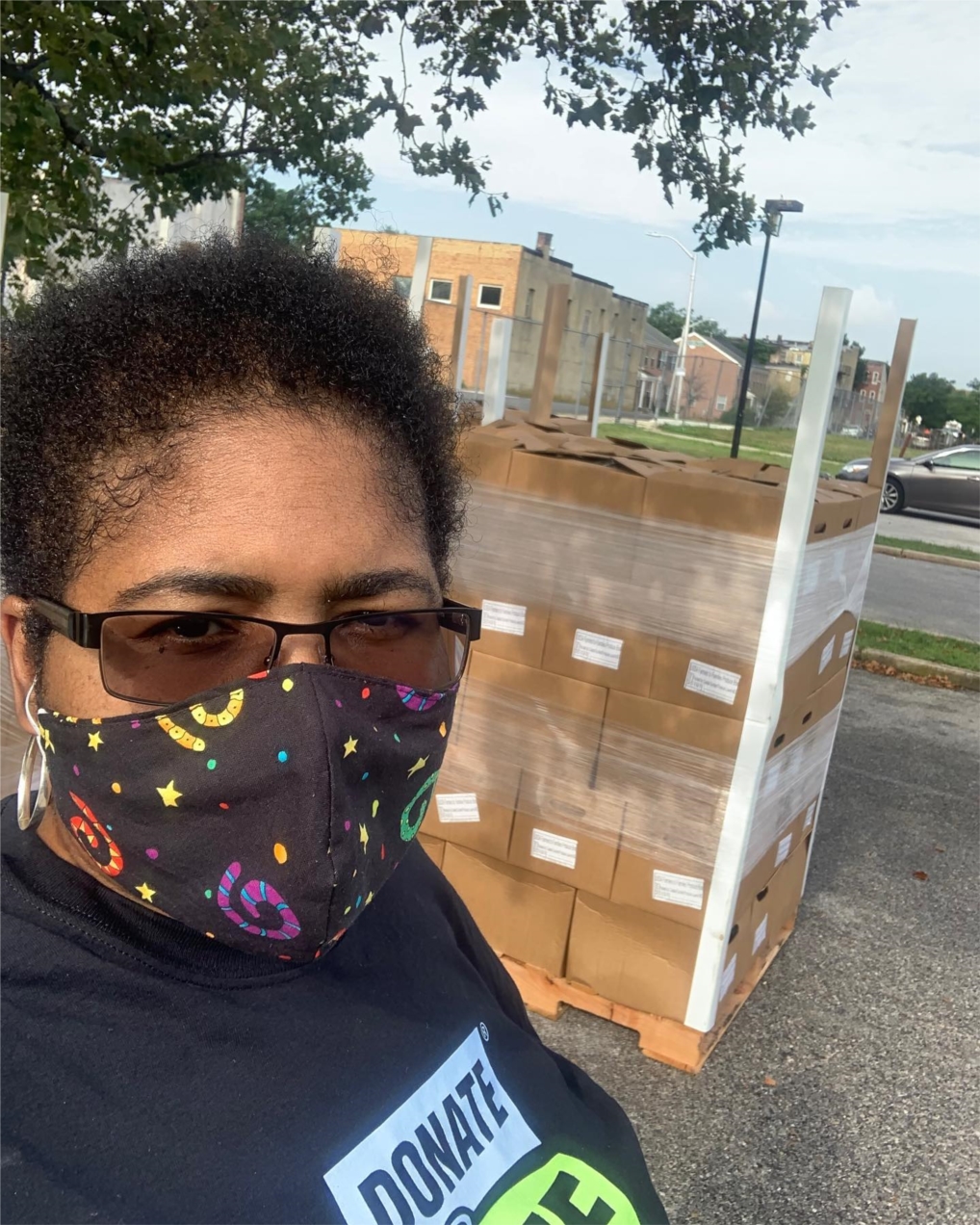 o	Caption: Latrice Price, Community Outreach Specialist, getting ready for a food giveaway in the Sandtown district of Baltimore City in July 2020 as part of The Decision Project initiative.