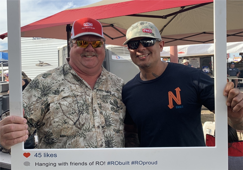 Teammates smile for a photo at the Austin Rodeo