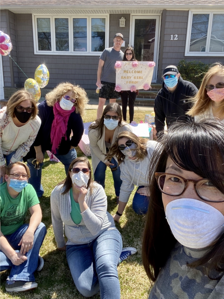 Austin Williams employees gathered during the pandemic lockdown to throw a drive-by baby shower for a co-worker. 