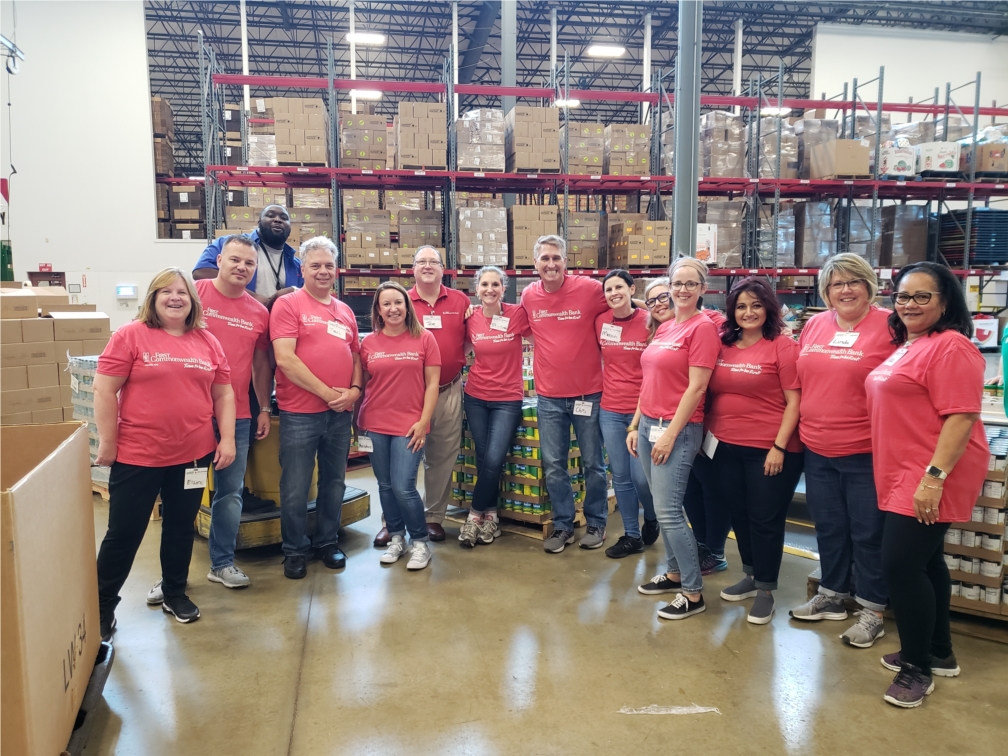 Participants from the First Commonwealth Mentorship Program volunteer at the Greater Pittsburgh Community Food Bank.