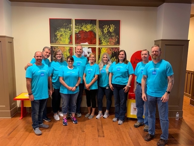 Serving the community is part of the cultural fabric of Schwab. Here Schwabbies celebrate the end of a fruitful day during Schwab volunteer week.  