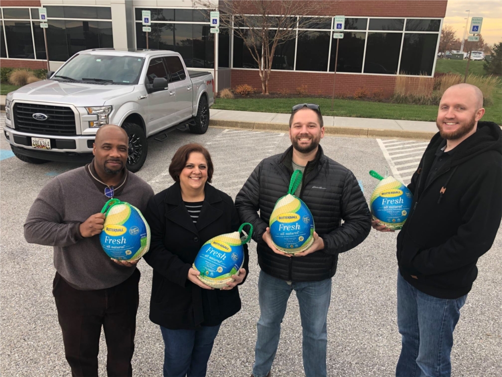 Each Thanksgiving, PCI provides turkeys to each employee. This photo, taken at the 2019 distribution event, shows PCI Corporate staff distributing turkeys.