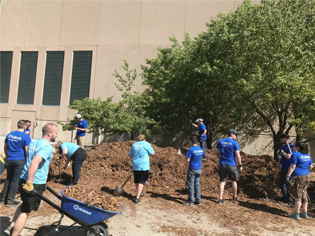 We give back! MRIoA employees volunteered time with West Valley City to spread mulch and beautify local city park properties.