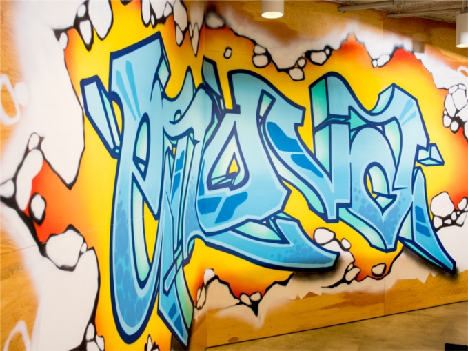 Enova’s graffiti walls were created by a local artist and provide an energetic backdrop for team members looking to collaborate away from their desks.