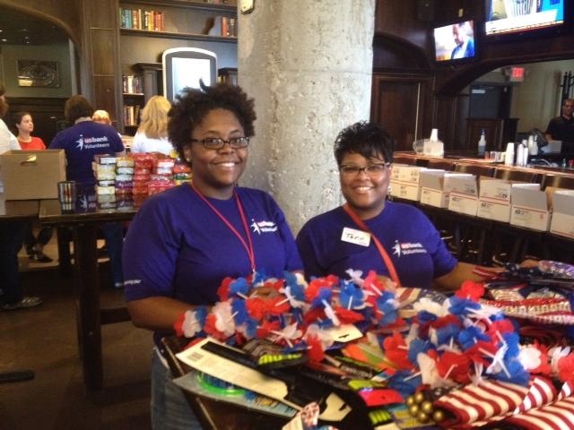 Fifty U.S. Bank employee volunteers sorted and packaged Fourth of July themed items for our deployed troops. The care packages included party favors, decorations, candy, snacks, movies and books. Fourth of July greeting cards and personal notes of thanks were included in each care package.