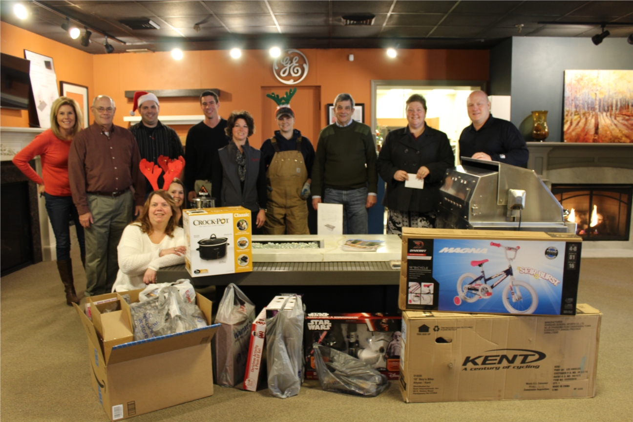 C. Bennett employees donating Adopt A Family gifts through nonprofit organization, F.A.C.T. 