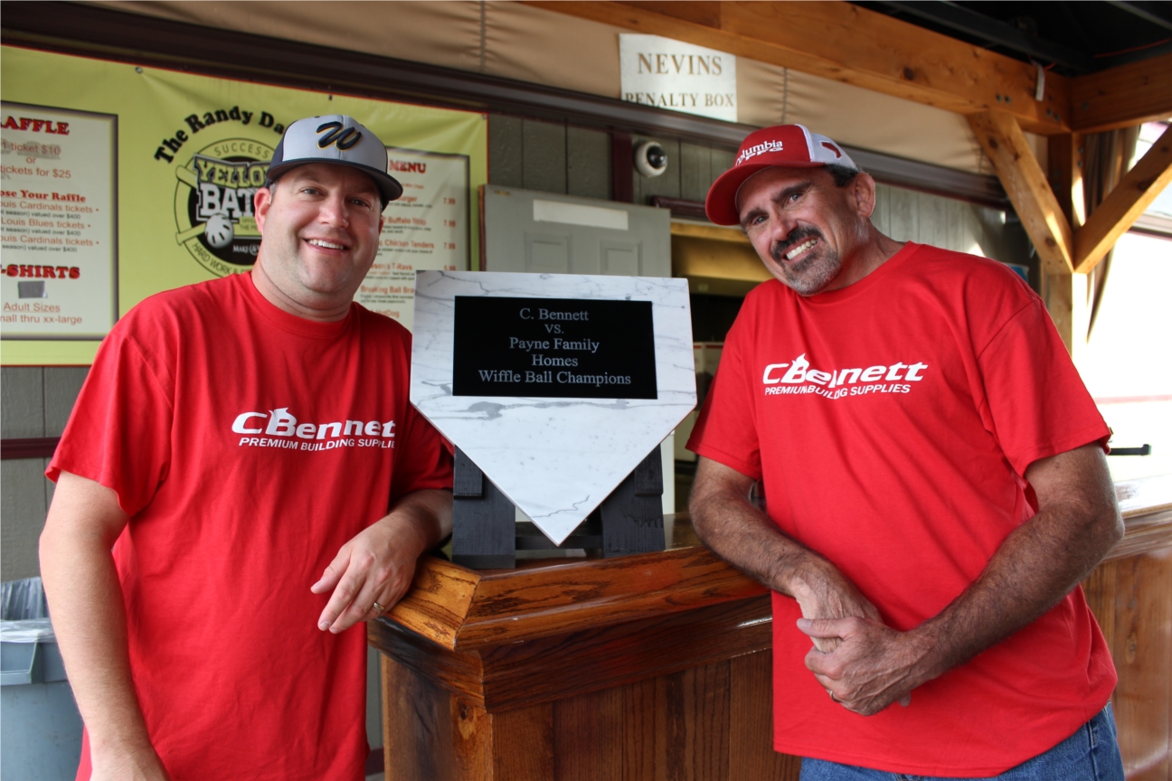 Builder Salespeople Louie and Bruce celebrating their Wiffle Ball Tournament victory at Yellowbatz in O' Fallon.  