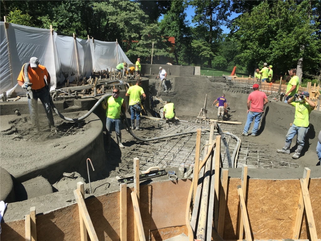 Our fantastic crew hard at work shooting a concrete pool shell.