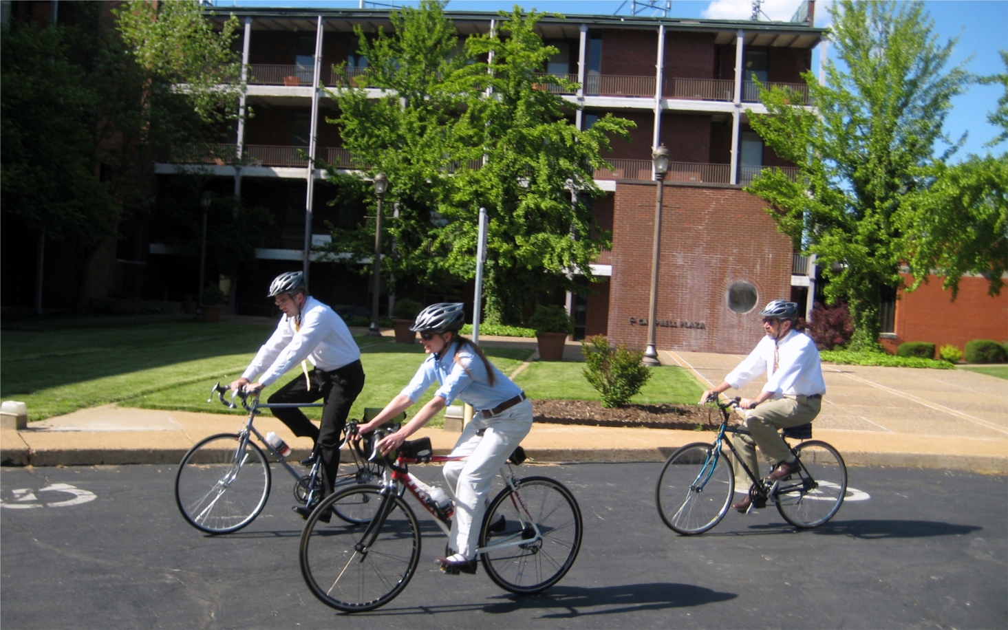 Employees taking advantage of a nice day by getting some exercise using the Company bikes.