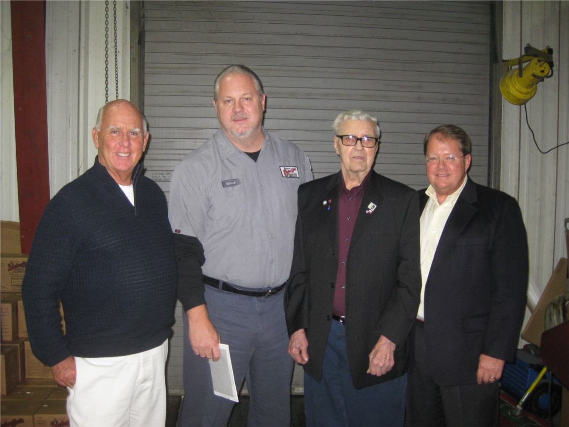 Left to right: Tom Hermann, CEO; Richard Niedbalski, vice president of production; Mike Ryterski, master grease maker; and Jay Shields, president. Ryterski has been with Schaeffer for over 70 years.