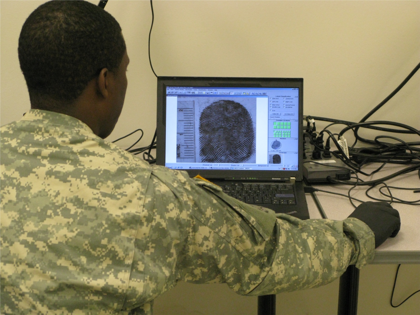 Finger print comparisons are demonstrated for a site exploitation course.