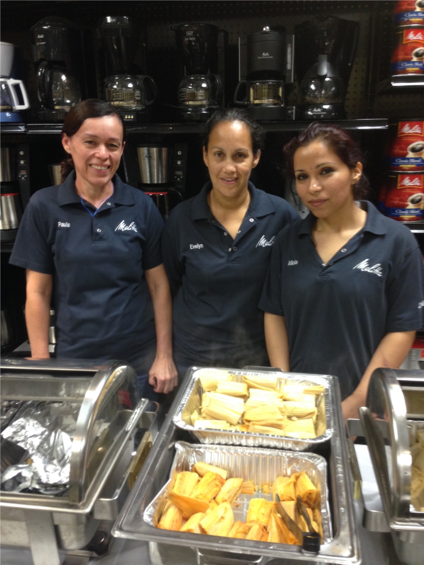 Melitta employees preparing a homemade lunch for sharing.