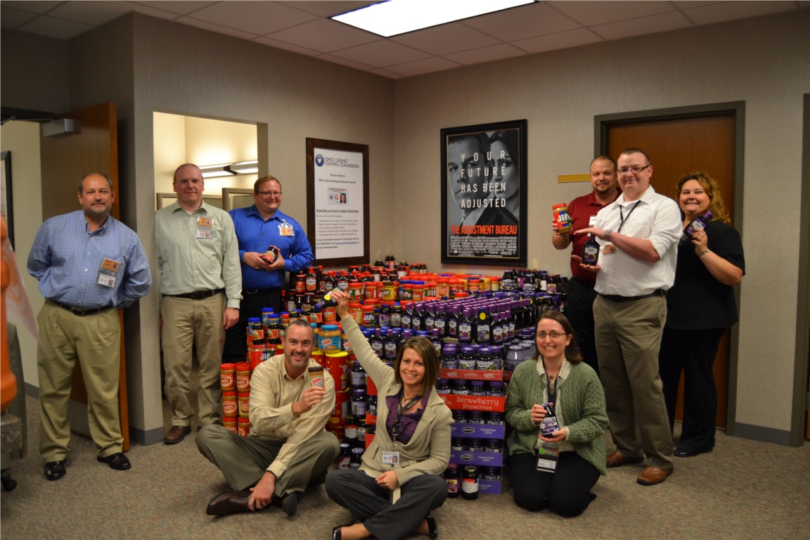 The Hollywood Cares Committee with 1,480 pounds of the peanut butter and jelly that was donated by our team members to assist Food for Thought in the Toledo area.