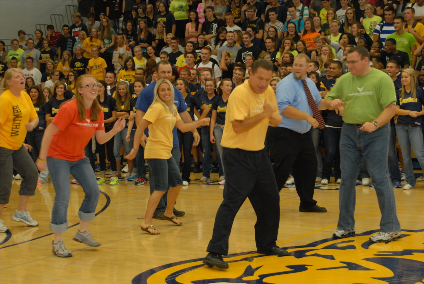 Superintendent Hickey and high school staff members are active participants in the pep rallies at Whitmer.  Friendly competition between staff and students is always fun.