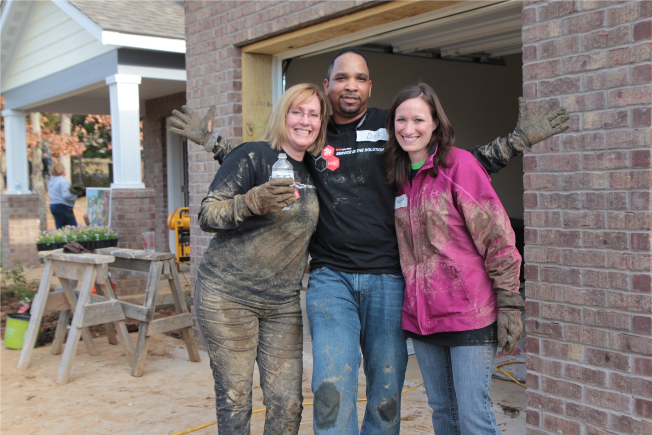 Laura Sullivan, DeMarius Scales, and an ENA friend at 2014's Habitat for Humanity build.