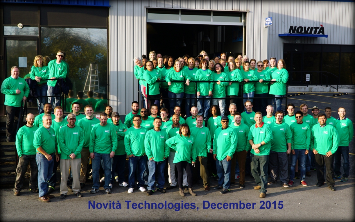 Novità staff and team members wearing company shirts in December 2015.