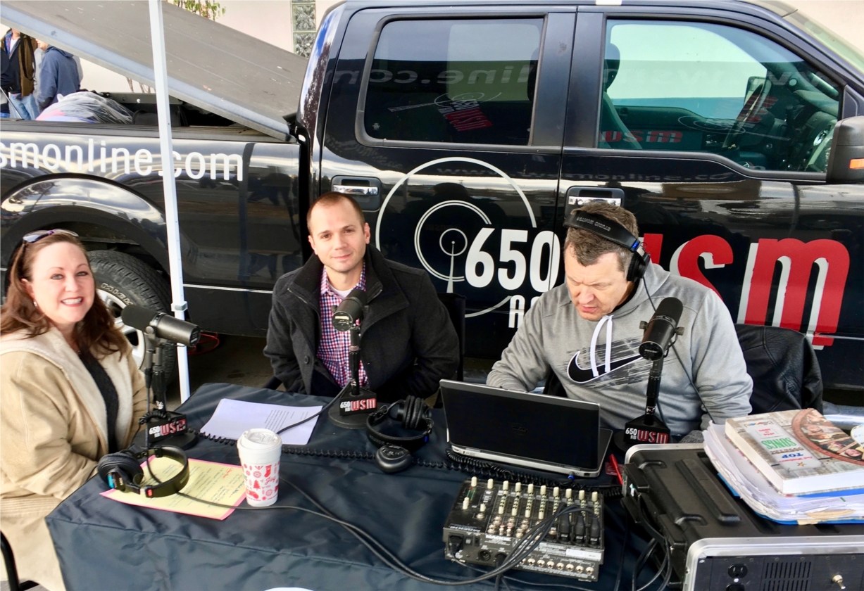 Accurate Mortgage Group sponsored the 2016 Tracy Lawrence annual turkey fry to support the Nashville Rescue Mission. Marketing Director Ellen Sevier and VP of Sales Joe Stanford talk with Bill Cody of WSM-AM live at the event. 