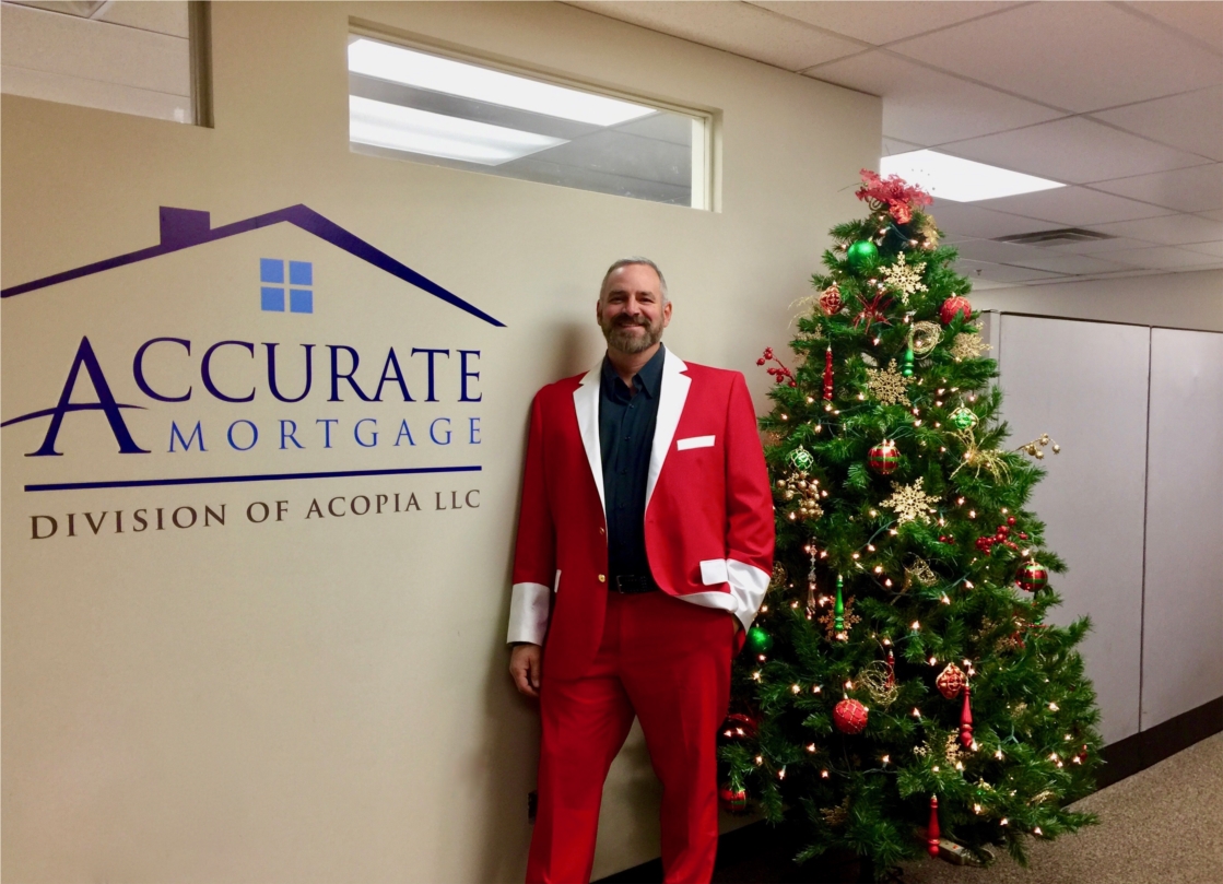 Accurate Mortgage Group's president, Mike Hoover, is dressed for holiday success before the annual company Christmas party. 