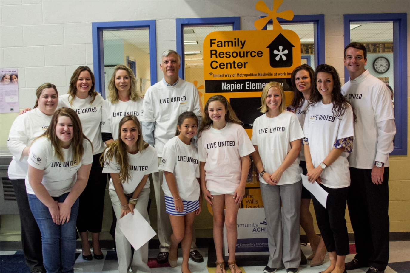Volunteers from Northwestern Mutual help stuff and hand out backpacks at Napier Elementary. 