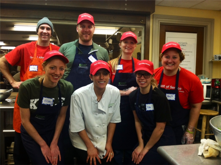 Booz Allen volunteers finish serving meals at Miriam's Kitchen in Washington, DC.
