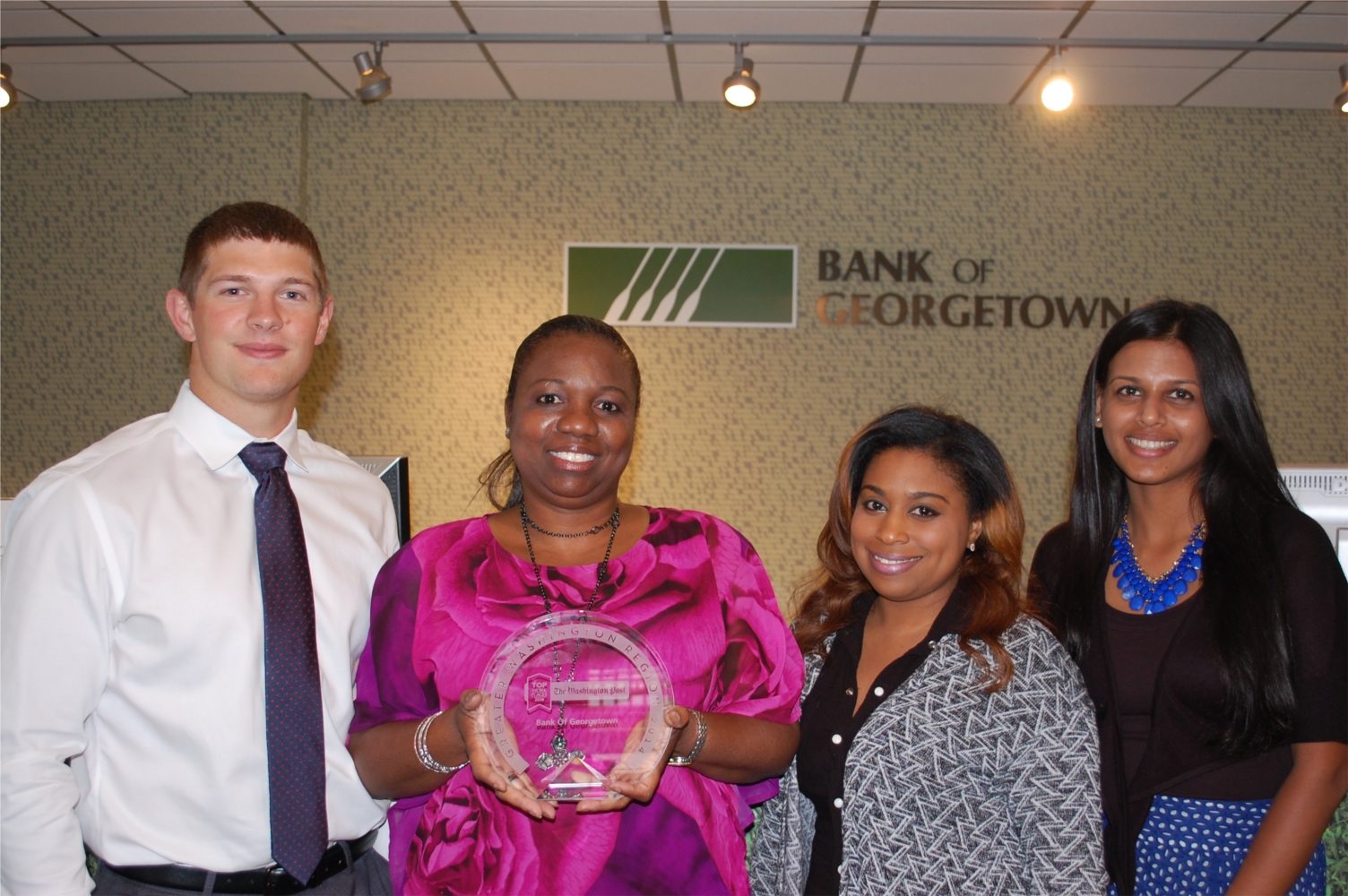 Shortly after Bank of Georgetown was named a 2014 Top Workplace, a team of employees made surprise visits to the 11 banking locations around MD, DC and VA. They circulated the crystal Top Workplaces award so that every employee could share in the honor and delivered ice cream treats as a bonus!