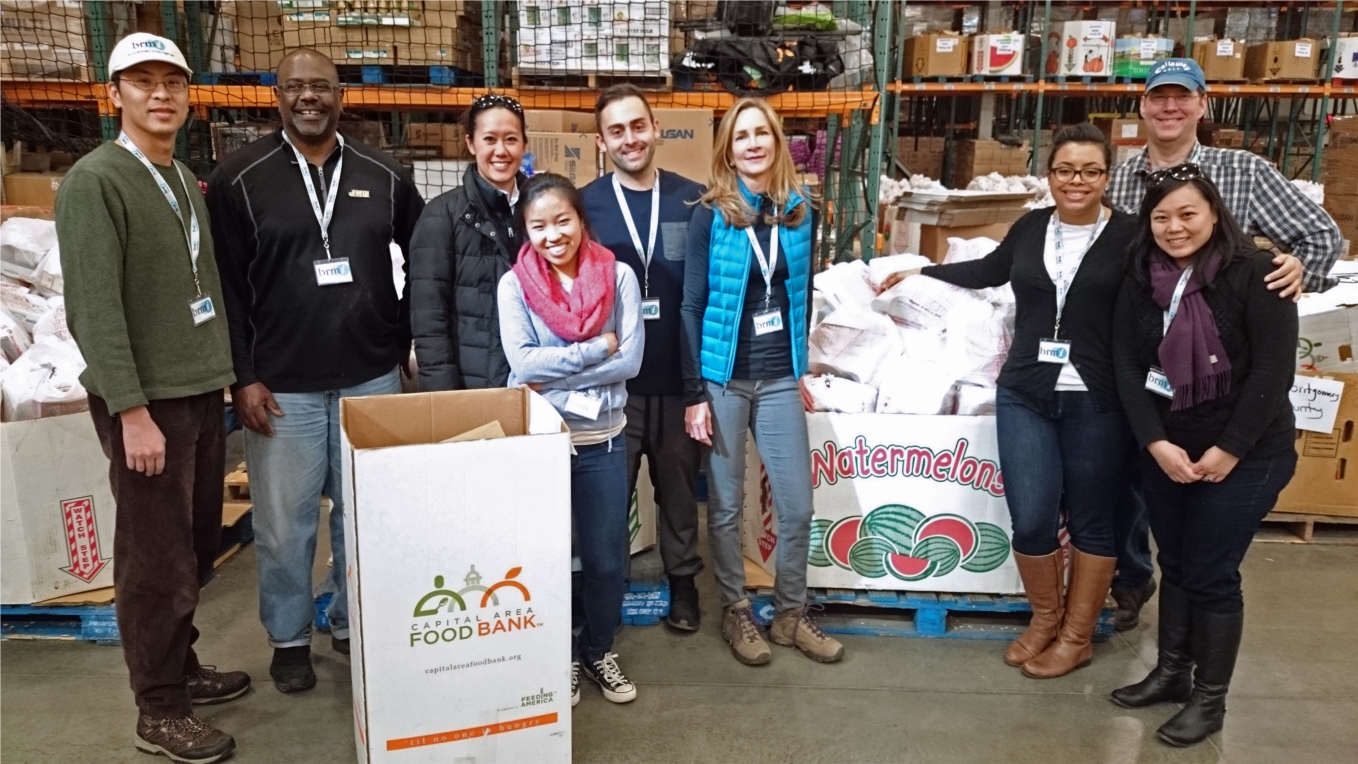At one of BRMi's most recent service projects, employees helped sort food at the Capital Area Food Bank. 