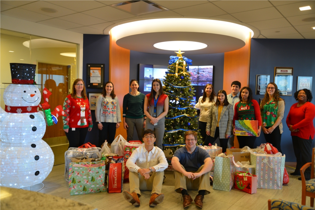 DAC's annual Giving Tree. Each year we partner with New Hope Housing to bring joy to local families in need